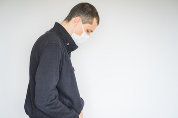 coronavirus, a man in a mask on a white background. Title about the outbreak of the corona virus in China, illness. Epidemic