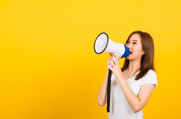 woman teen standing making announcement message shouting screaming in megaphone