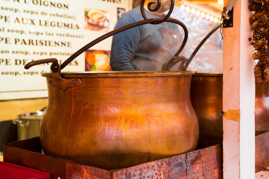 Beautiful Giant Cauldron Close-up. Shiny Bronze. Christmas Market Food Stand, Paris, France.