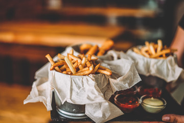 french fries in buckets in a bar