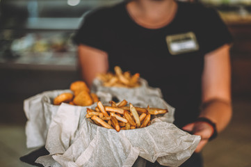 french fries in buckets in a bar
