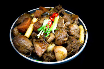 Korean chicken stew with soy sauce, glass noodle, rice cake and vegetables