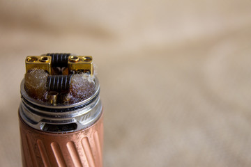 Mechanical vaper on a brown background. Mechanical vaper on a brown background. Capless