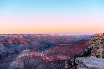 Fototapeta na wymiar Beautiful view of the Grand Canyon painted by the rays of stunning pink sunset