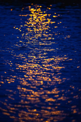 Yellow light reflection on water