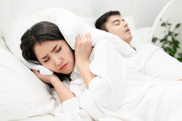 The asian wife have problems with snoring husband. Marriage and divorce issues.