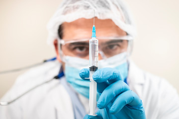 caucasian doctor with syringe