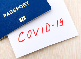 Coronavirus and travel concept. Note COVID-19 coronavirus and passport