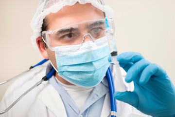Fototapeta premium caucasian doctor with syringe