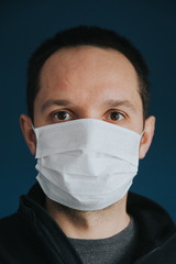 Worldwide alert of pandemic disease: Covid-19 concept. Man wearing protective mask during coronavirus alert. 