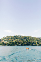 Fototapeta na wymiar boat on the lake, italian mountain lake