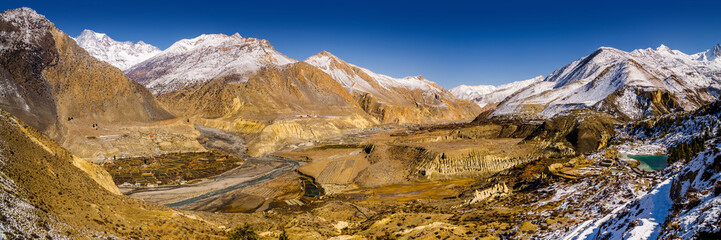Panoramic view of the Kali Gandaki river valley with Jomsom, Syange, Dhumba and Thinigaon villages in winter sunny day. Annapurna circuit / Jomsom trek, Nepal.