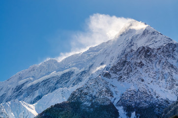 Snow covered Mt. Nilgiri summit in sunny day. Kali Gandaki valley, Annapurna circuit / Jomsom trek,...