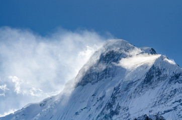 Snow covered Mt. Nilgiri summit in sunny day. Kali Gandaki valley, Annapurna circuit / Jomsom trek,...