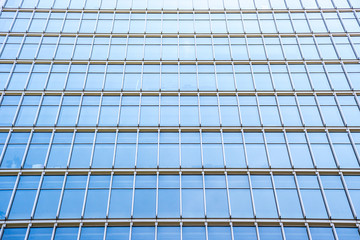 Fototapeta na wymiar underside panoramic and perspective view to steel blue glass high rise building skyscrapers, business concept of successful industrial architecture