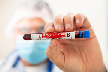 Fototapeta premium Doctor holding test tube blood sample