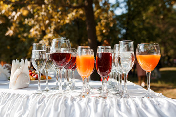 Red and yellow juice in tall glasses