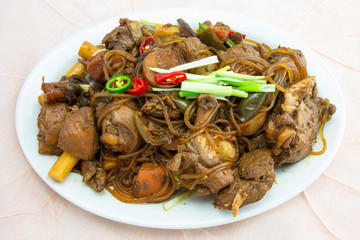 Korean chicken stew with soy sauce, glass noodle, rice cake and vegetables