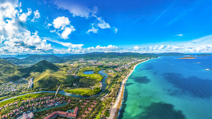 Coastal Scenery of Luxury Resort with Villas, Yacht Marina and Recreational Beach at Yalong Bay, Sanya, Hainan Island, a Tourism Destination for Summer Vacation in China, with Tropical Climate.