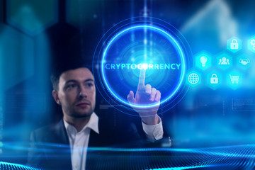 Business, Technology, Internet and network concept. Young businessman working on a virtual screen of the future and sees the inscription: Cryptocurrency