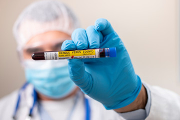 Doctor holding test tube blood sample