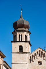 Closeup of the Bell tower of the San Vigilio Cathedral (Duomo di Trento, 1212-1321) in Romanesque style, Trento downtown, Trentino-Alto Adige, Italy, Europe
