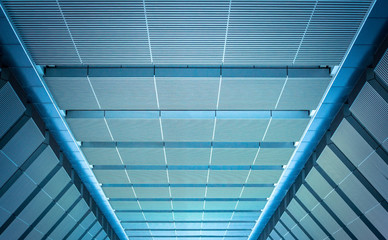 underside panoramic and perspective view to steel blue glass high rise building skyscrapers, business concept of successful industrial architecture