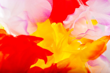 Abstract background of colorful artificial flowers