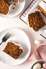 Carrot cake with cream cheese frosting for Easter decorated. Top view.