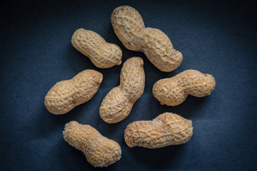 Peanut in a shell and cleared on a neutral background