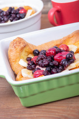 dutch German pancake topped with bluberries berries fruit and banana