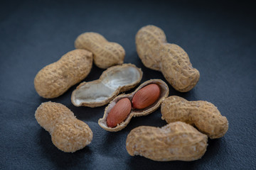 Peanut in a shell and cleared on a neutral background