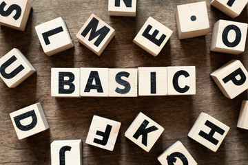 Wood letter block in word basic on wood background with another alphabet