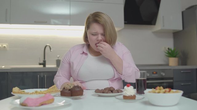 Crying Obese Woman Eating Sweet Cakes And Drinking Soda, Compulsive Overeating