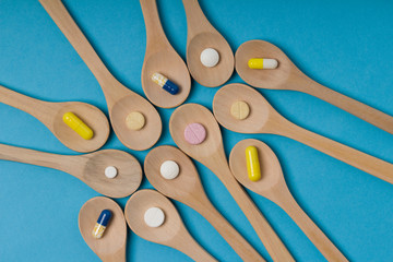 Tablets on a wooden spoon. Pills. Medicine and healthy.  pharmaceutical medicine pills