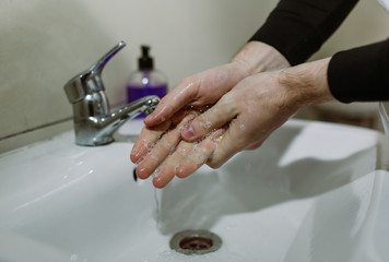 Man washing hands carefully with soap. disinfection protection from Coronavirus Covid-19 