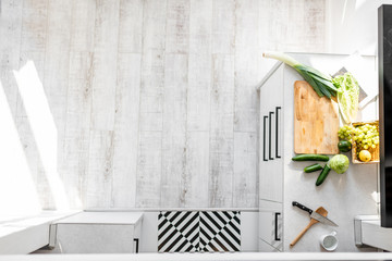 Top view on the modern kitchen with food ingredients on the table, view with copy space on the floor