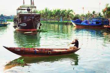 Senior woman on boat in Thu Bon River Hoi An
