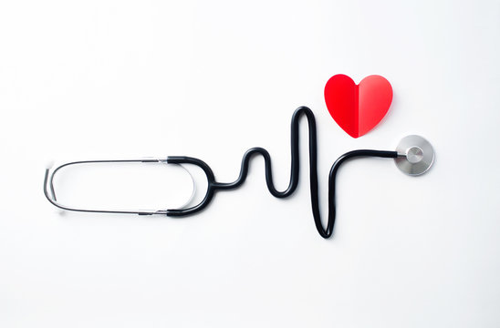 Heart disease concept. Medical stethoscope in the form of a heart rhythm on a white background. Copy space for text.