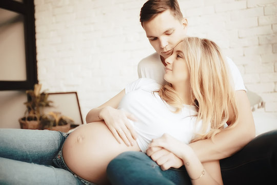 big belly pregnancy man kisses / family and childbirth, concept of family happiness and love, man and woman