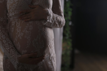 pregnant girl big belly at home / concept of pregnancy and childbirth, comfort