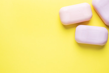 Natural soap on a yellow background. Flat lay the concept of Spa cleanliness of hands. copy space