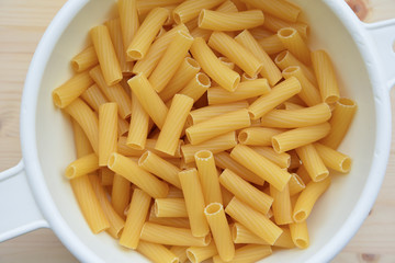 Italian Macaroni in the Bowl on Wooden table