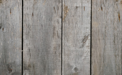 Old wooden boards. Background natural wooden boards. Texture of old unpainted wooden planks. Vertical arrangement of shabby wooden boards.
