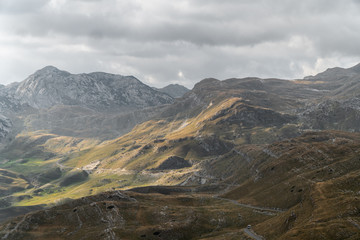 Scenic view of the mountains. Mountain road meanders between the hills. Background