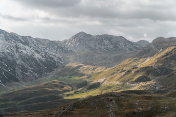 Scenic view of the mountains. Mountain road meanders between the hills. Background