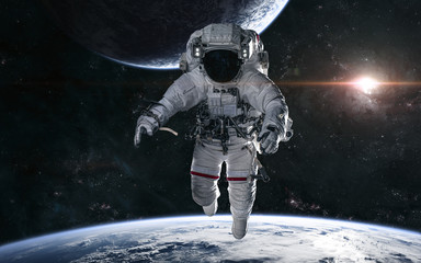 Astronaut on the background of a bright star in the center of the galaxy. Deep space planets....