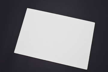 white paper surface on a black background