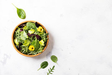 Salad from a fresh mix of leafy greens. Antiviral healthy food. Vitamins.