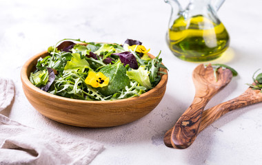 Salad from a fresh mix of leafy greens. Antiviral healthy food. Vitamins.